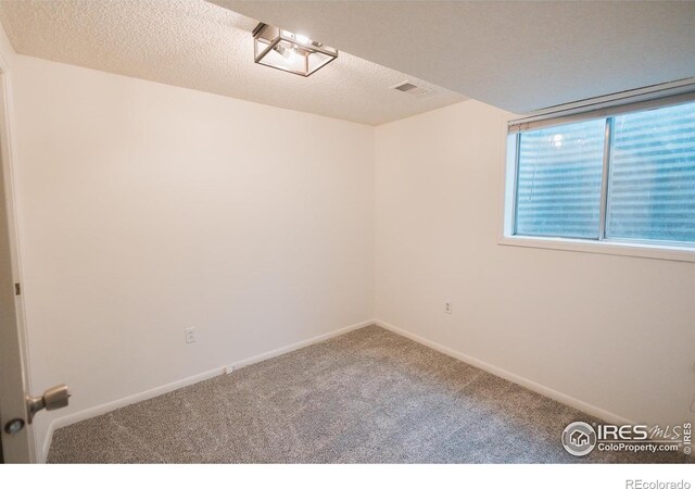 3025 Regatta Ln Unit 3, Fort Collins, CO 80525 - carpeted spare room with baseboards and a textured ceiling