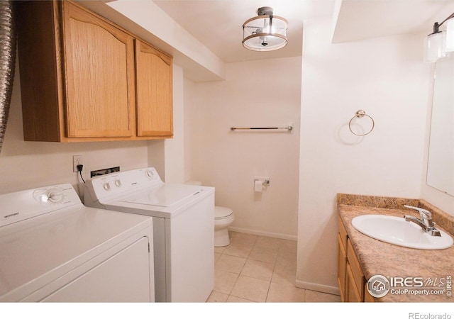 3025 Regatta Ln Unit 3, Fort Collins, CO 80525 - laundry area with washing machine and dryer and light tile patterned floors