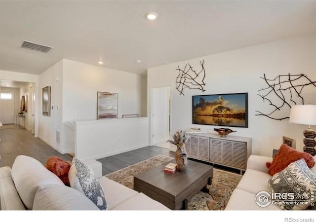 1885 Mount Monroe Dr, Berthoud, CO 80513 - living area featuring wood finished floors and recessed lighting