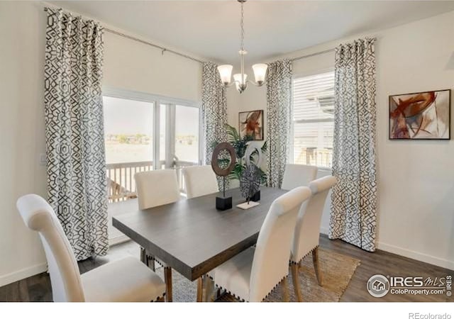 1885 Mount Monroe Dr, Berthoud, CO 80513 - dining space with a chandelier and dark wood-style floors