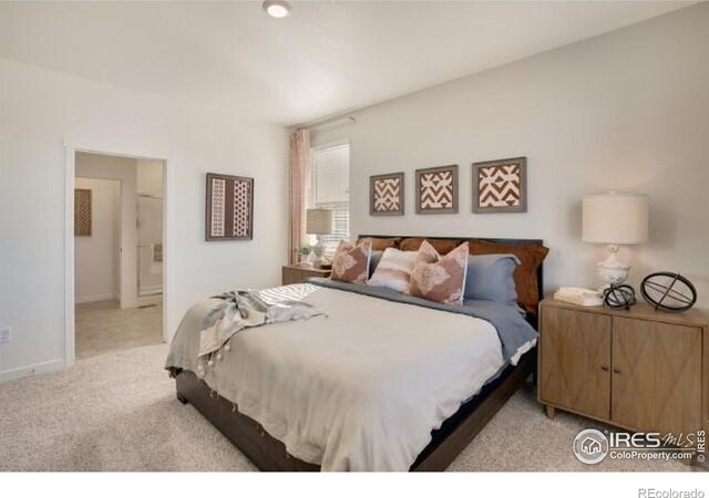 1885 Mount Monroe Dr, Berthoud, CO 80513 - bedroom featuring light carpet and ensuite bath