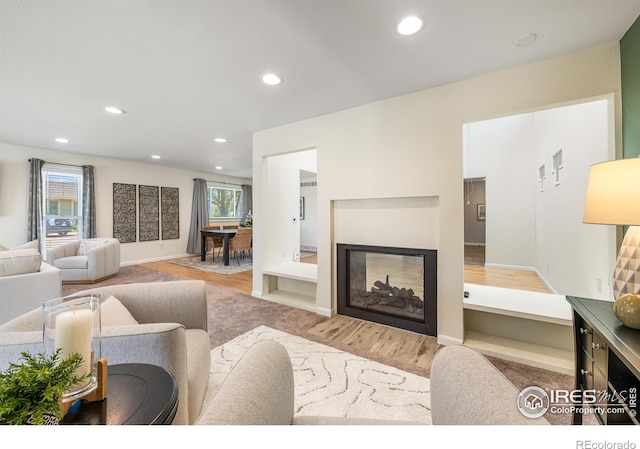 40 Walter Way, Broomfield, CO 80020 - living area with a multi sided fireplace, recessed lighting, and wood finished floors