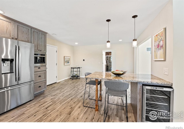 40 Walter Way, Broomfield, CO 80020 - kitchen featuring stainless steel fridge, wine cooler, light wood-style floors, recessed lighting, and pendant lighting