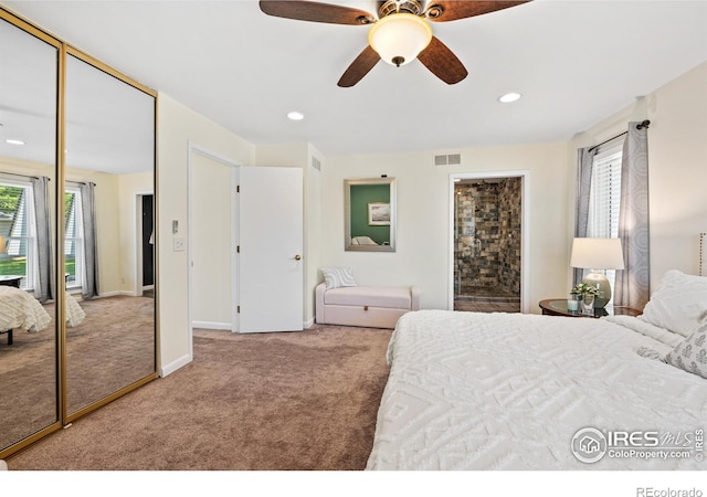 40 Walter Way, Broomfield, CO 80020 - carpeted bedroom with recessed lighting, ceiling fan, a closet, and ensuite bath