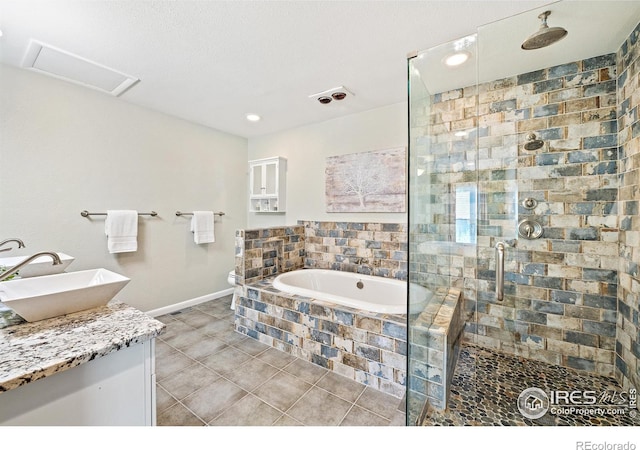 40 Walter Way, Broomfield, CO 80020 - bathroom with a stall shower, a bath, tile patterned flooring, vanity, and recessed lighting