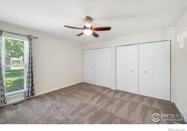 40 Walter Way, Broomfield, CO 80020 - unfurnished bedroom featuring carpet flooring, multiple closets, and ceiling fan