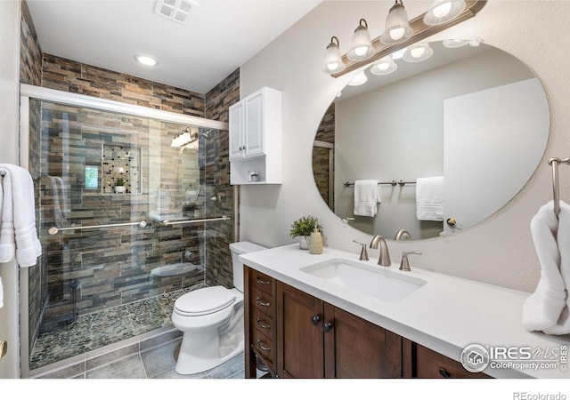 40 Walter Way, Broomfield, CO 80020 - bathroom featuring vanity, a stall shower, tile patterned floors, and recessed lighting