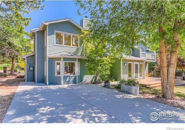 725 Union Ave, Boulder, CO 80304 - view of front of property featuring a patio area, a chimney, and a wooden deck