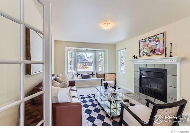 725 Union Ave, Boulder, CO 80304 - living area with a tiled fireplace and baseboards