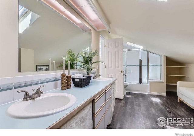 725 Union Ave, Boulder, CO 80304 - full bathroom with double vanity, wood finished floors, shower / bath combination with glass door, plenty of natural light, and lofted ceiling