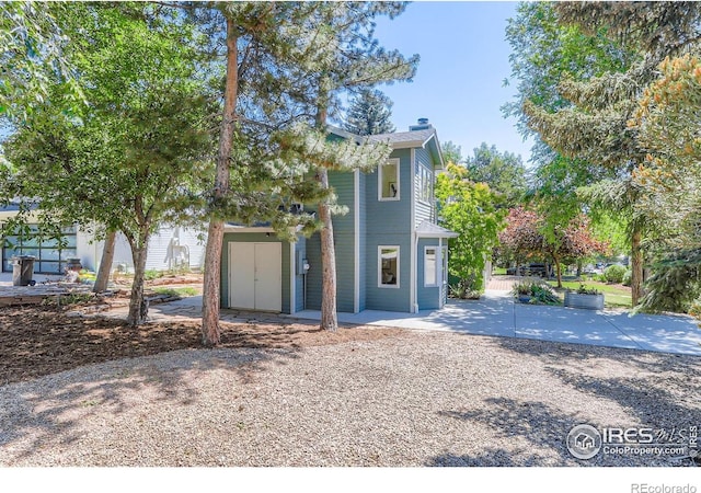 725 Union Ave, Boulder, CO 80304 - view of front of home with a patio and a chimney