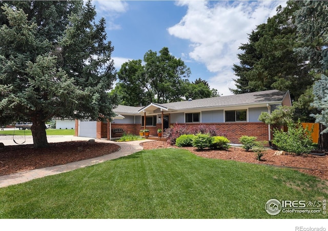 7459 Mount Meeker Rd, Longmont, CO 80503 - single story home with brick siding, a garage, and concrete driveway