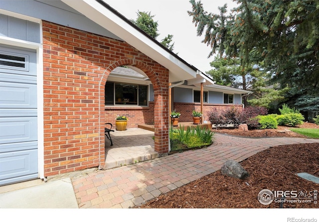 7459 Mount Meeker Rd, Longmont, CO 80503 - property entrance featuring brick siding