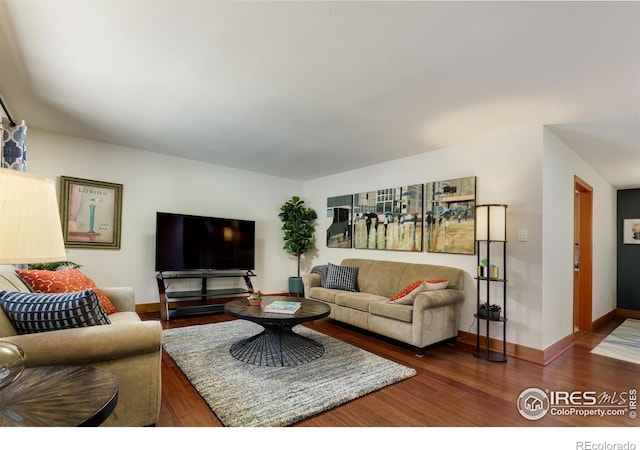 7459 Mount Meeker Rd, Longmont, CO 80503 - living room with dark wood finished floors and baseboards