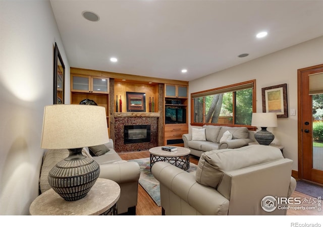 7459 Mount Meeker Rd, Longmont, CO 80503 - living area with recessed lighting, plenty of natural light, light wood-type flooring, and a fireplace