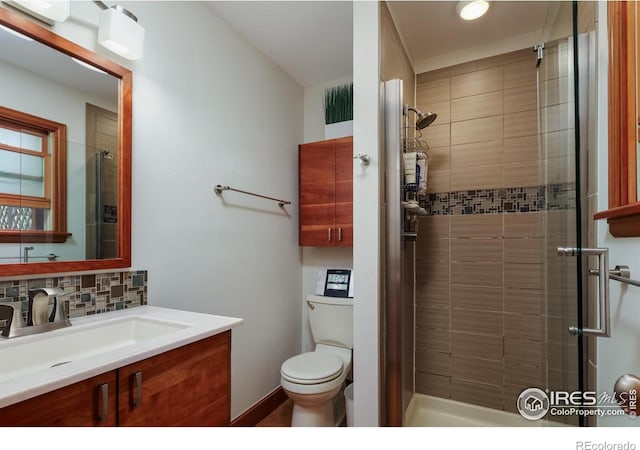 7459 Mount Meeker Rd, Longmont, CO 80503 - bathroom featuring a stall shower, vanity, and backsplash