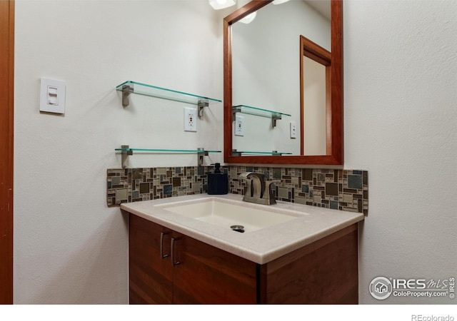 7459 Mount Meeker Rd, Longmont, CO 80503 - bathroom featuring tasteful backsplash and vanity