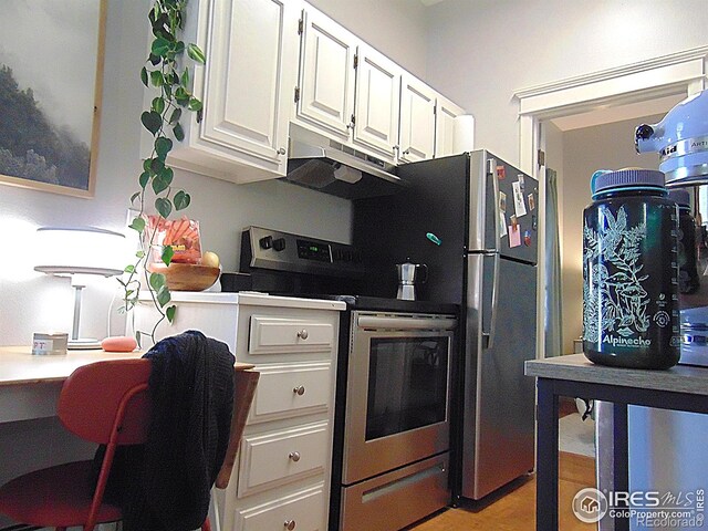 2205 Arapahoe Ave Unit 3, Boulder, CO 80302 - kitchen with stainless steel range with electric stovetop, under cabinet range hood, and white cabinets