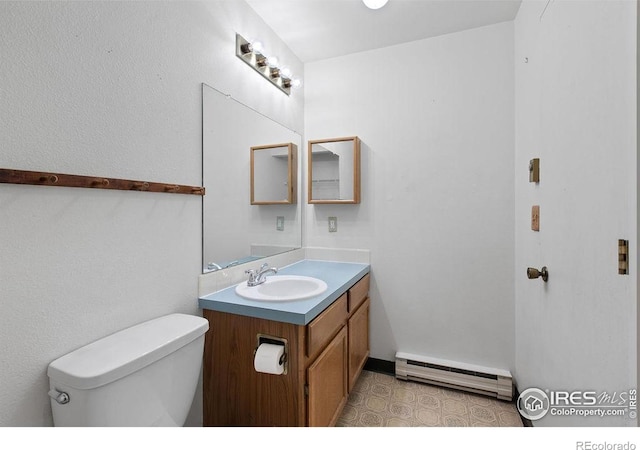 3565 Windmill Dr Unit F-7, Fort Collins, CO 80526 - half bathroom with a baseboard heating unit and vanity
