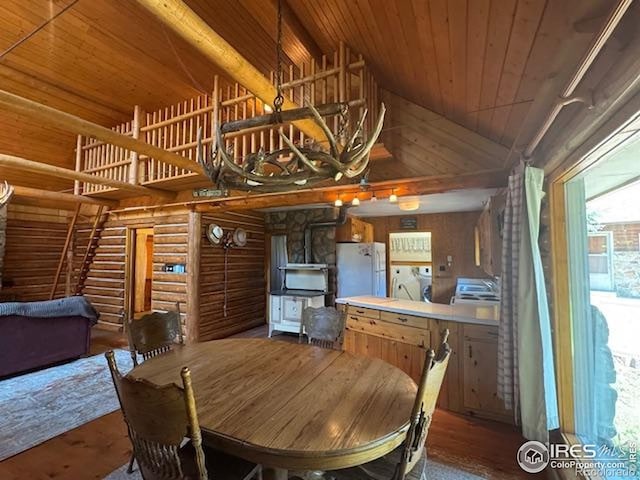 110 Meadow Ln, Bellvue, CO 80512 - dining space with wood ceiling, high vaulted ceiling, log walls, washer / clothes dryer, and wood finished floors