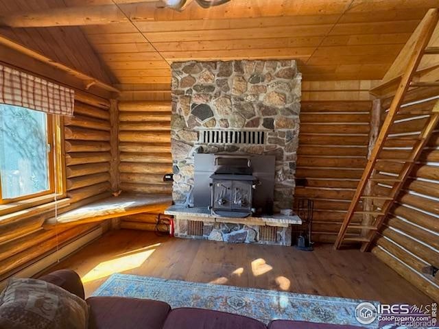 110 Meadow Ln, Bellvue, CO 80512 - living area with wood ceiling, rustic walls, hardwood / wood-style flooring, lofted ceiling, and a baseboard heating unit