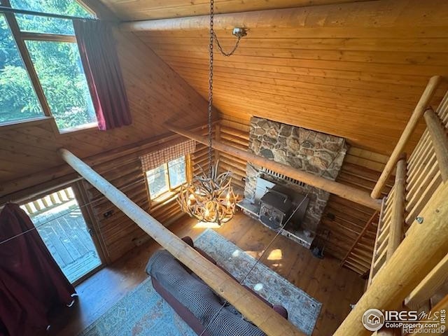 110 Meadow Ln, Bellvue, CO 80512 - living room with hardwood / wood-style flooring, wood ceiling, high vaulted ceiling, a chandelier, and rustic walls