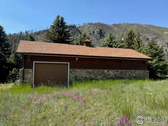 110 Meadow Ln, Bellvue, CO 80512 - garage featuring a mountain view