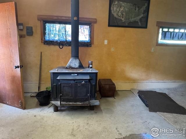 110 Meadow Ln, Bellvue, CO 80512 - detailed view of a wood stove and concrete flooring