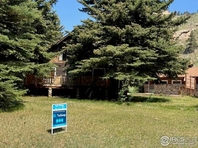 110 Meadow Ln, Bellvue, CO 80512 - view of grassy yard featuring a wooden deck