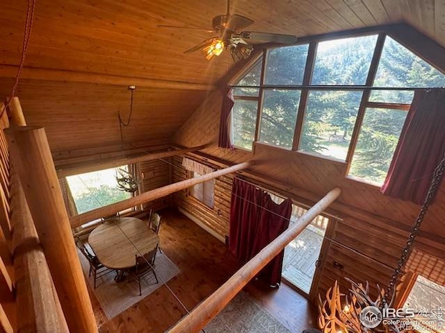 110 Meadow Ln, Bellvue, CO 80512 - staircase featuring wood ceiling, lofted ceiling, wooden walls, a ceiling fan, and wood finished floors
