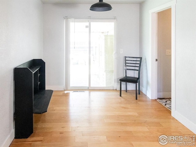 2037 Wedgewood Ct, Greeley, CO 80631 - living area with light wood-style flooring and baseboards