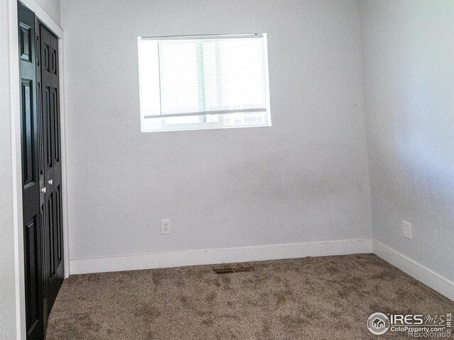 2037 Wedgewood Ct, Greeley, CO 80631 - spare room featuring carpet flooring and baseboards