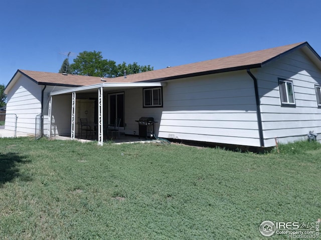 2037 Wedgewood Ct, Greeley, CO 80631 - rear view of house featuring a yard and a patio