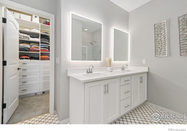 641 Babine Ct, Windsor, CO 80550 - bathroom with a shower stall, double vanity, and a walk in closet