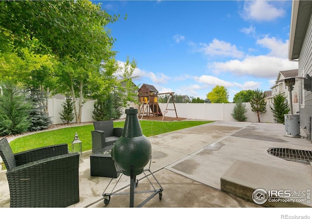 641 Babine Ct, Windsor, CO 80550 - fenced backyard featuring a patio and a playground