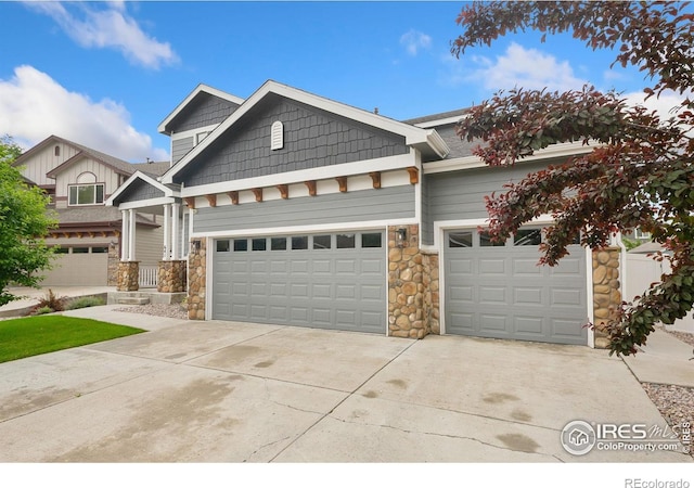 641 Babine Ct, Windsor, CO 80550 - craftsman-style home with stone siding, driveway, a garage, and board and batten siding