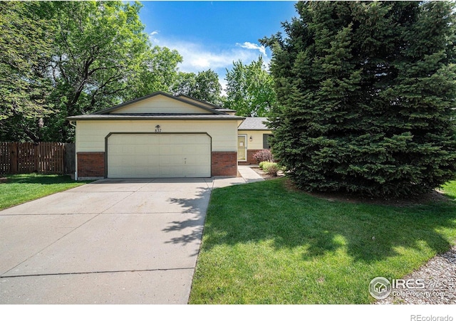 837 Arbor Ave, Fort Collins, CO 80526 - view of front of property with brick siding, driveway, and a garage