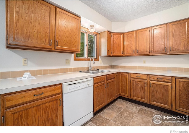 837 Arbor Ave, Fort Collins, CO 80526 - kitchen featuring dishwasher, brown cabinets, light countertops, and a textured ceiling