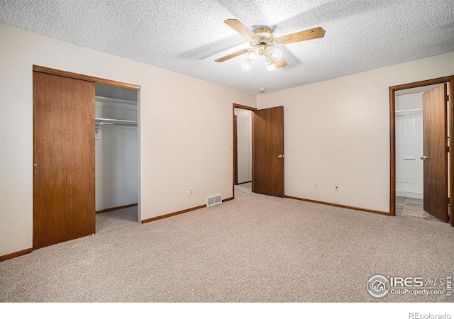 837 Arbor Ave, Fort Collins, CO 80526 - unfurnished bedroom featuring carpet flooring, a closet, a textured ceiling, and a ceiling fan