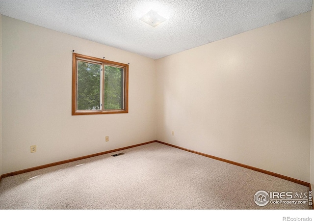 837 Arbor Ave, Fort Collins, CO 80526 - unfurnished room featuring carpet and a textured ceiling
