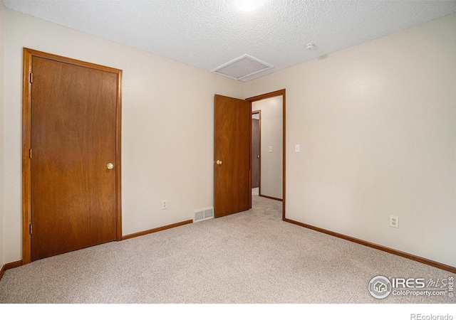837 Arbor Ave, Fort Collins, CO 80526 - empty room with carpet flooring, attic access, a textured ceiling, and a smoke detector