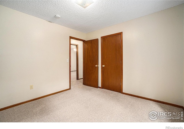 837 Arbor Ave, Fort Collins, CO 80526 - spare room featuring carpet flooring and a textured ceiling