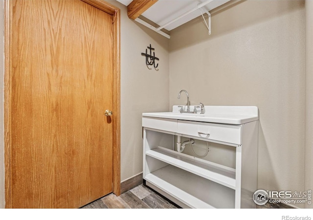 2217 Waylon Dr, Johnstown, CO 80534 - washroom with wood finished floors and a sink
