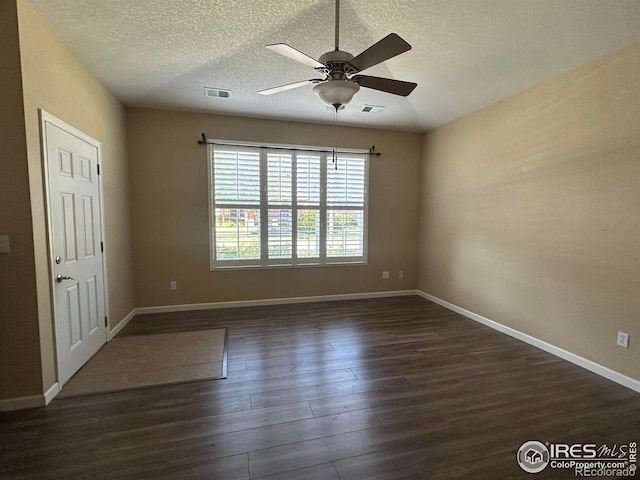 1238 Finch St, Loveland, CO 80537 - unfurnished room with dark wood finished floors, a ceiling fan, and a textured ceiling