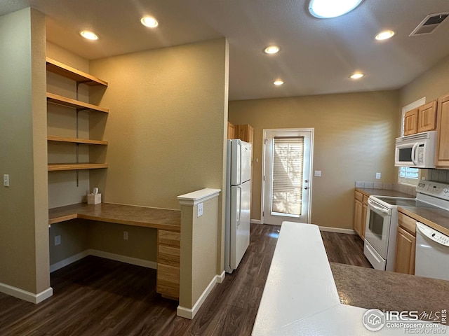 1238 Finch St, Loveland, CO 80537 - kitchen featuring white appliances, built in study area, dark wood-style floors, plenty of natural light, and recessed lighting