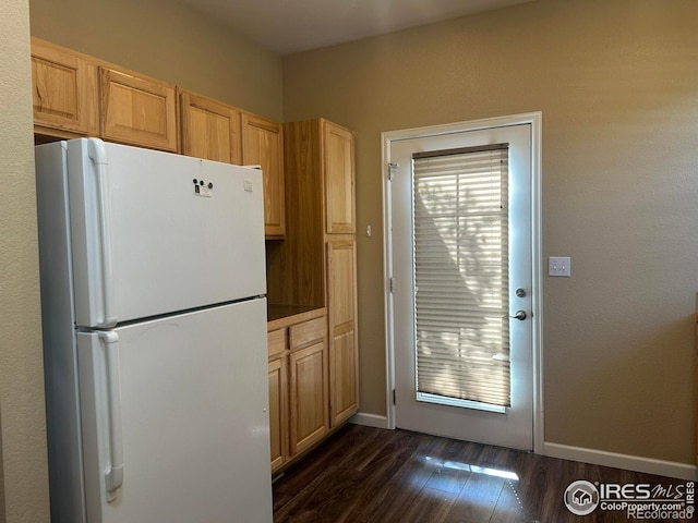 1238 Finch St, Loveland, CO 80537 - kitchen featuring freestanding refrigerator and dark wood-style floors