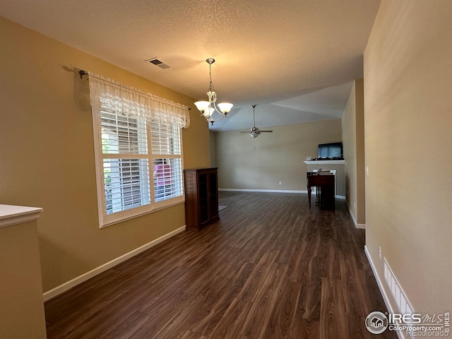 1238 Finch St, Loveland, CO 80537 - unfurnished dining area featuring dark wood-style floors, a chandelier, ceiling fan, and a textured ceiling
