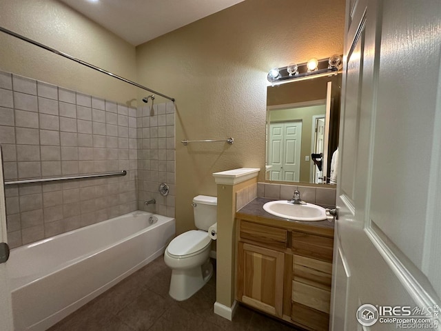 1238 Finch St, Loveland, CO 80537 - bathroom with tile patterned floors, vanity, shower / washtub combination, and a textured wall