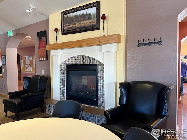 1238 Finch St, Loveland, CO 80537 - living area with arched walkways and a fireplace