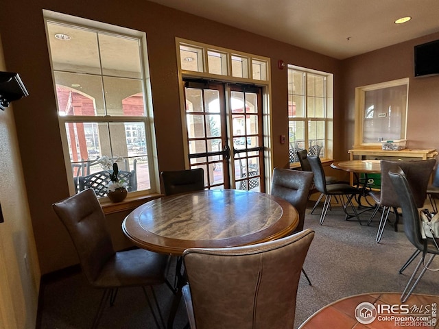 1238 Finch St, Loveland, CO 80537 - carpeted dining room with plenty of natural light and french doors